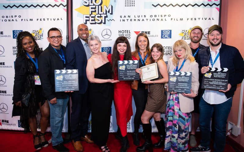 Photos of the 2023 Award winners standing in front of the red carpet